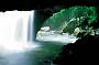 Water cascades into the Natural Bridge cave